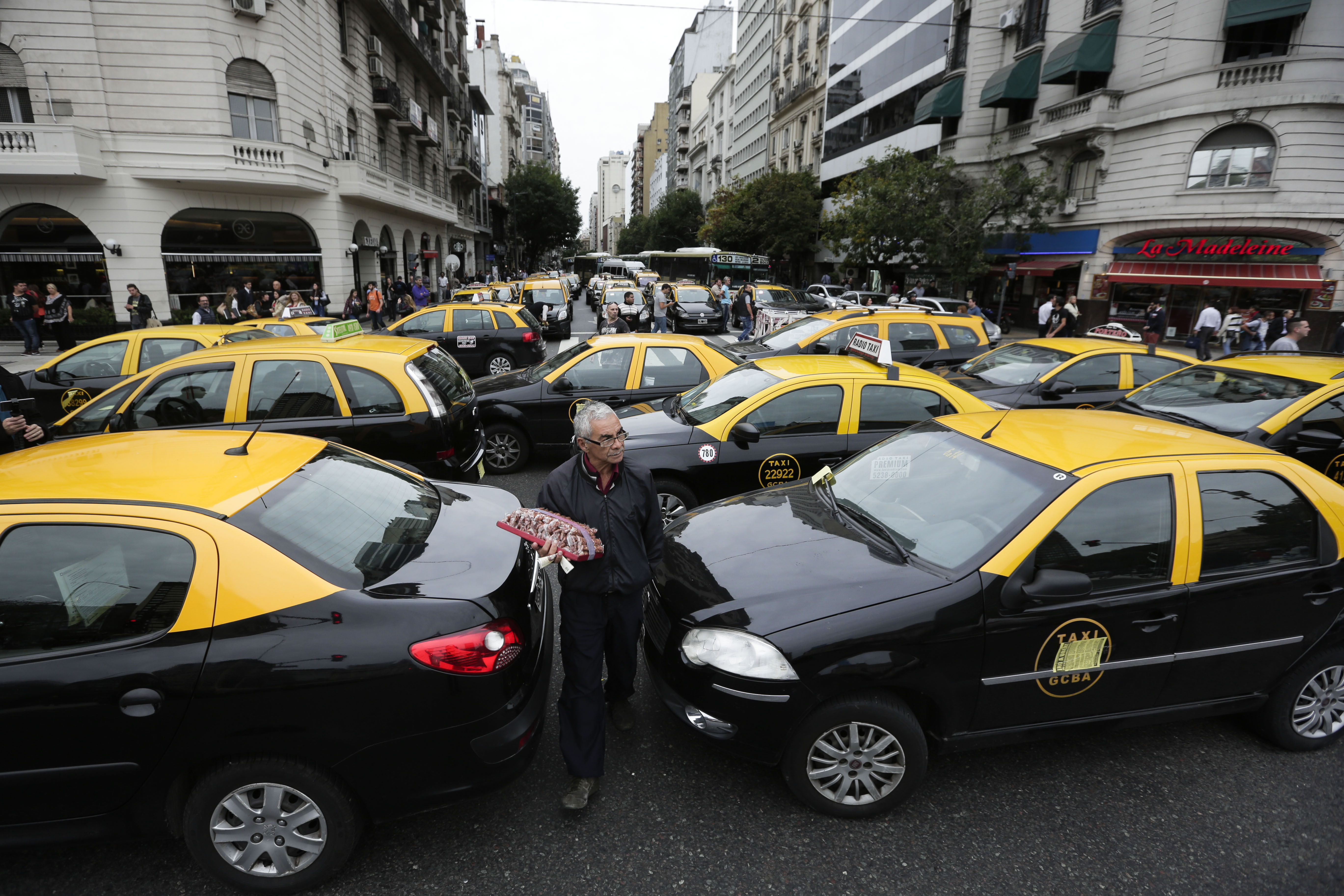 Argentina's Macri sides with taxi drivers against Uber