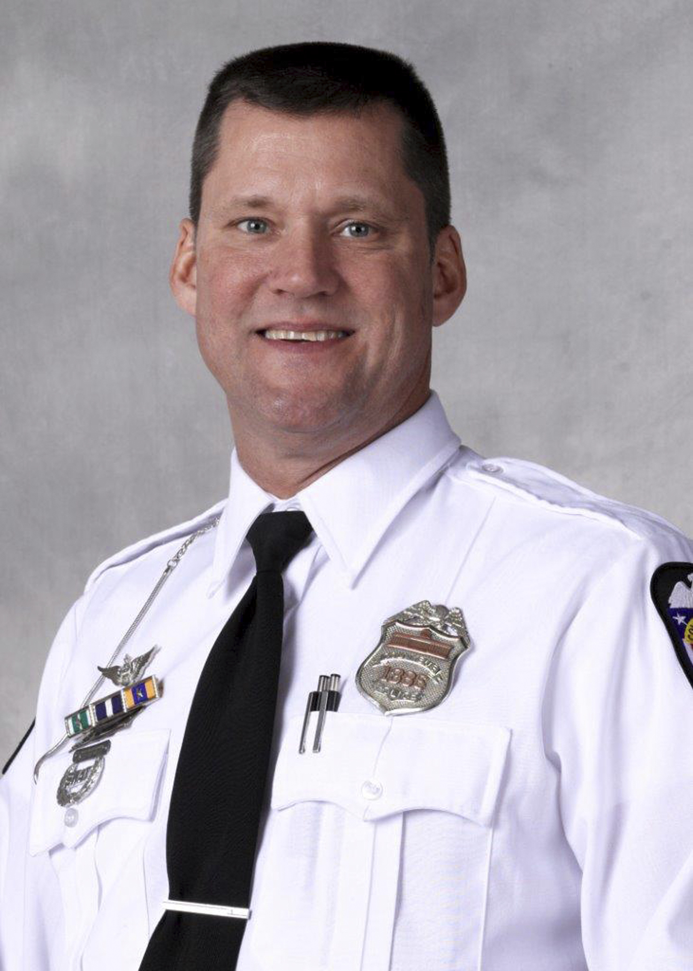 The Latest: Aggravated murder count filed in officer's death