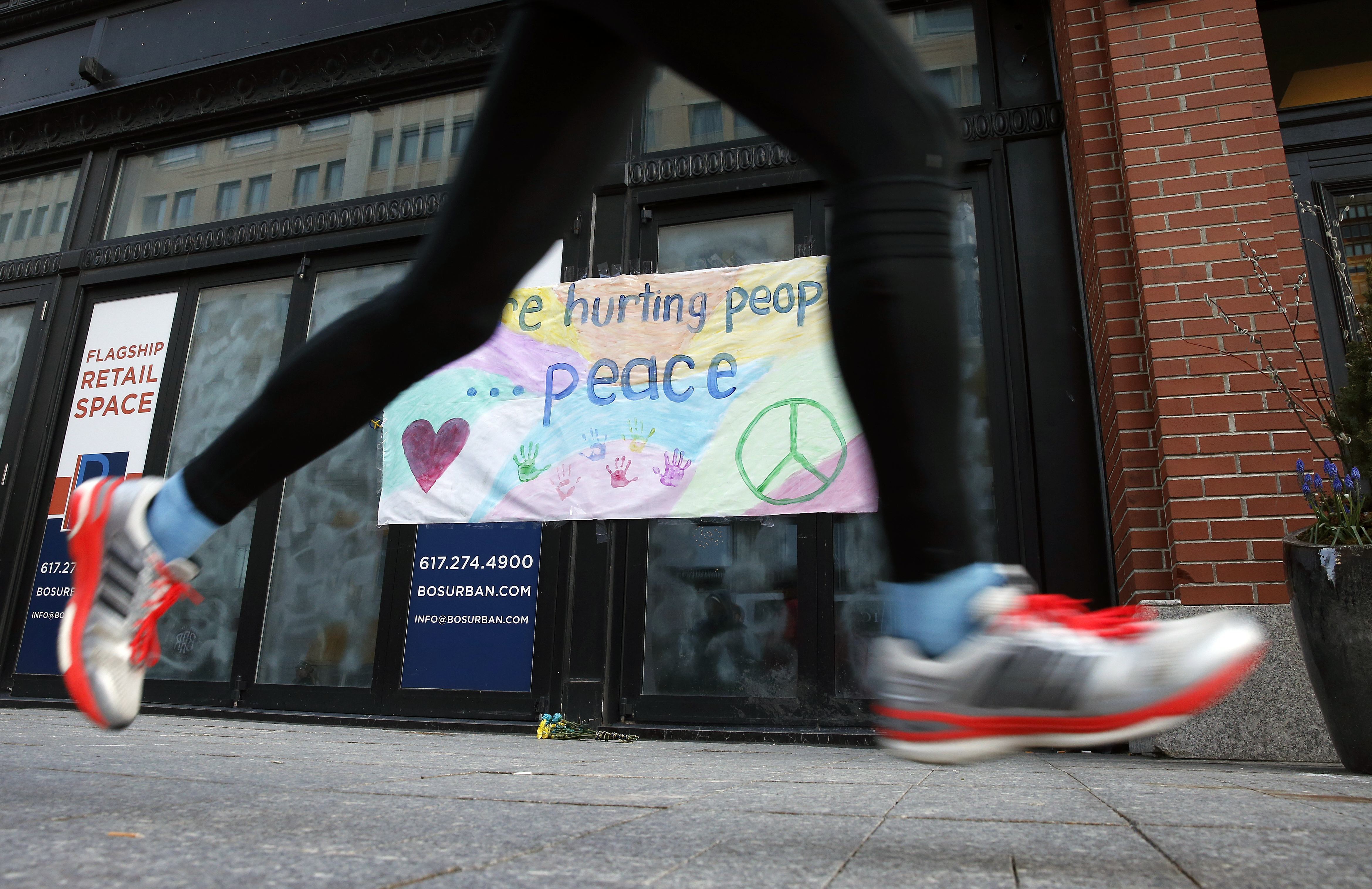 The Latest: Moment of silence observed for marathon bombing