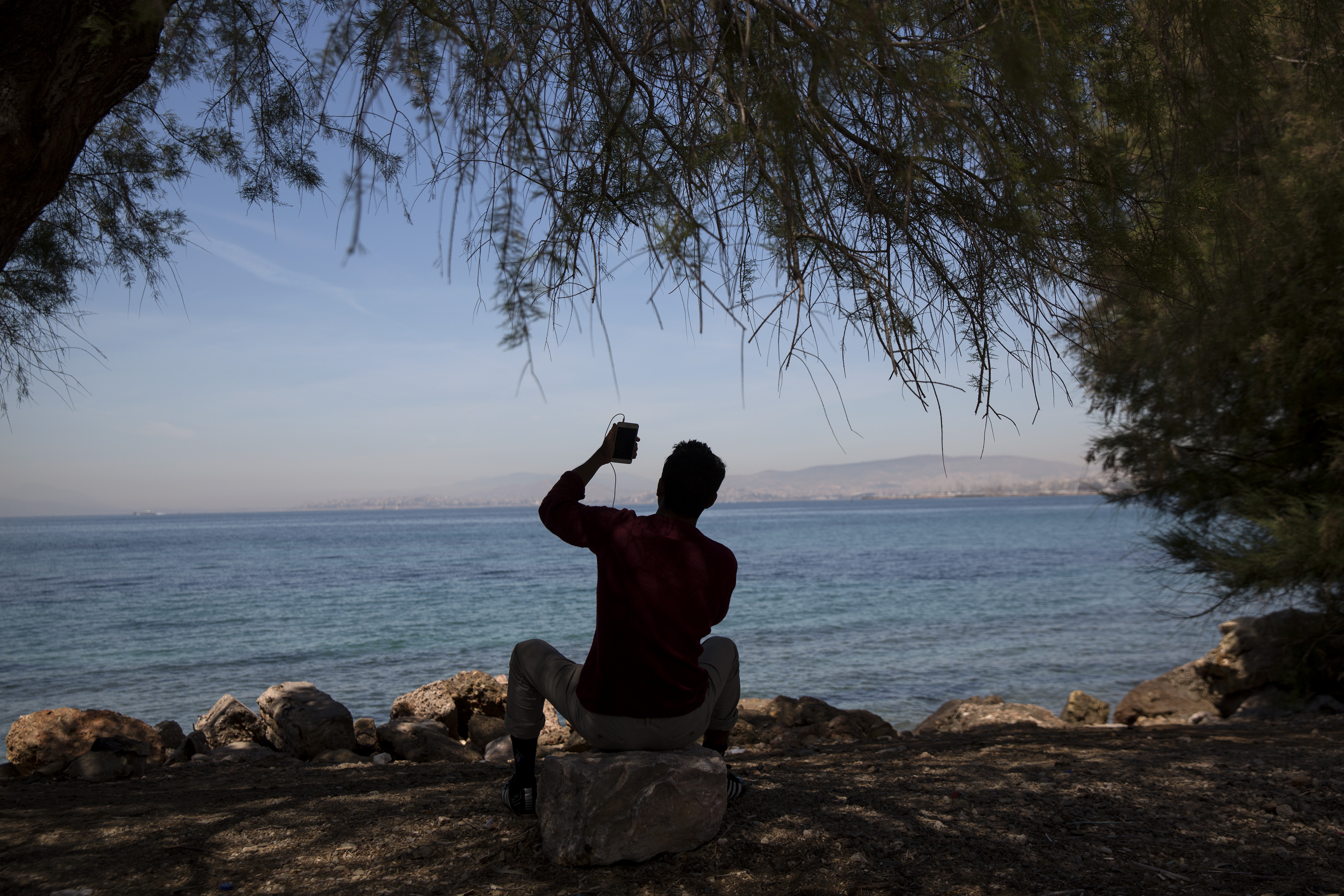 The Latest: 60 migrants rescued at sea by Spain