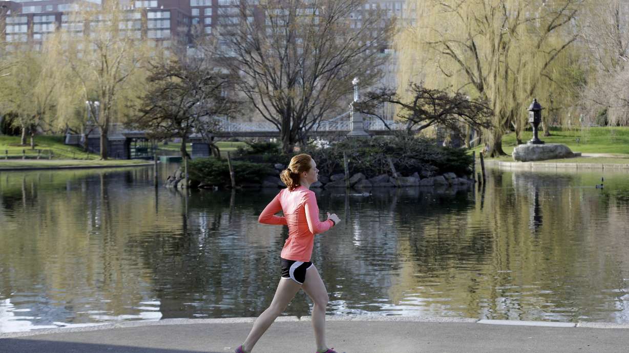 The Latest: Bomb survivor runs marathon on prosthetic blade