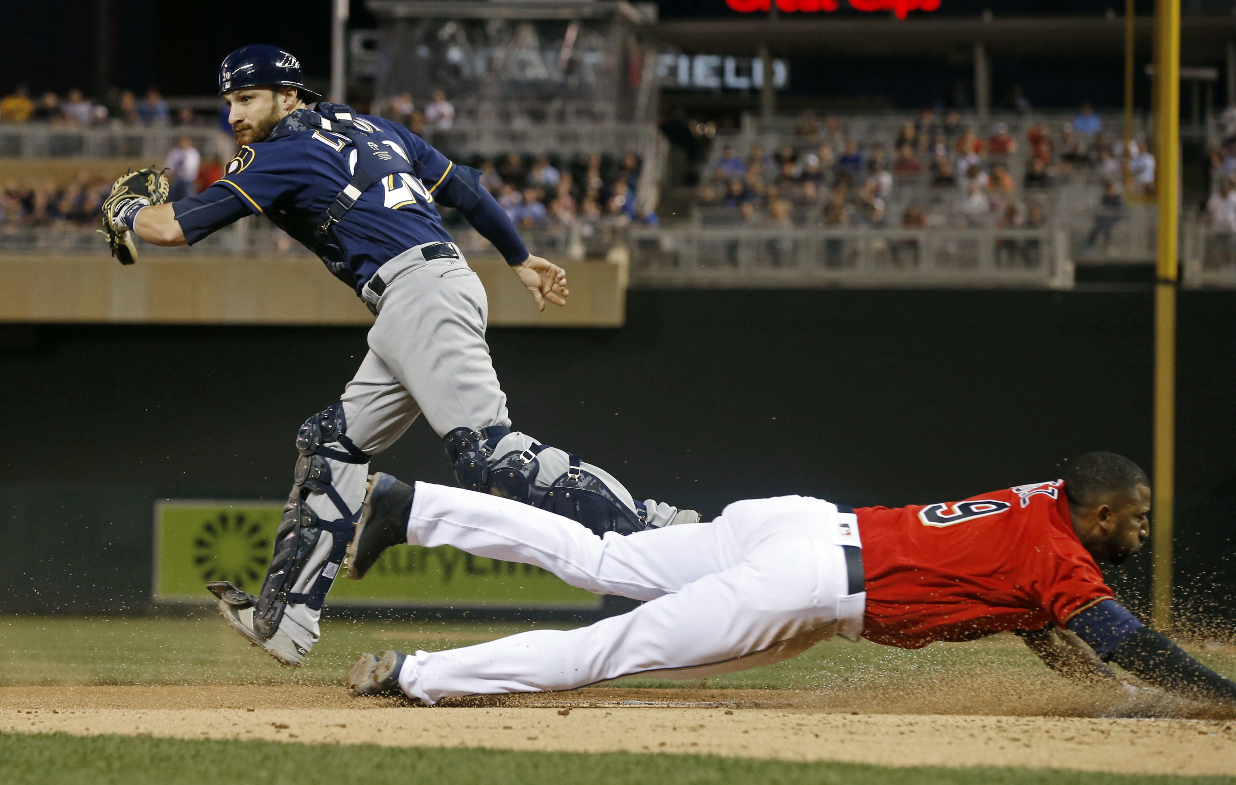 Twins top Brewers 7-4 in rain-shortened game for 4th in row