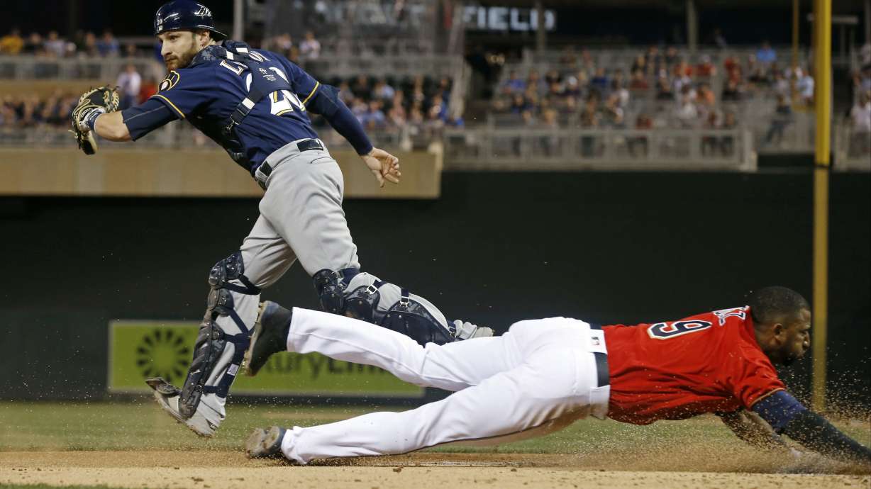 Twins top Brewers 7-4 in rain-shortened game for 4th in row