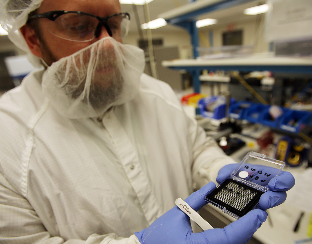 Blackrock Microsystems maintenance engineer Chrisman Cook holds electrode arrays for a photograph at the company's office in Research Park in Salt Lake City, Wednesday, April 20, 2016. (Photo: Chris Samuels, Deseret News)