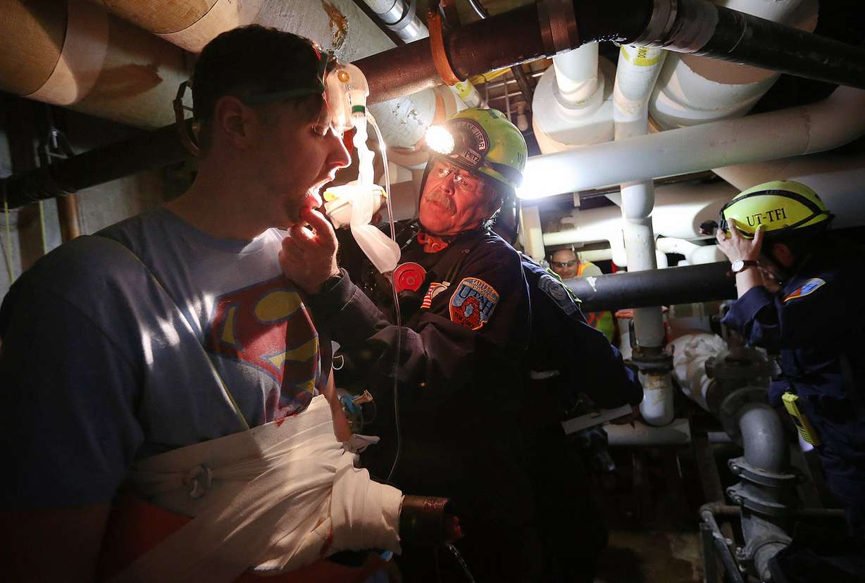 Patient David Link is attended to by search and rescue member Tom Hansen as hospital staff, students and emergency crews take part in mock emergency situations at St. Mark's Hospital in Salt Lake City, Thursday, April 21, 2016. (Photo: Scott Winterton, Deseret News)