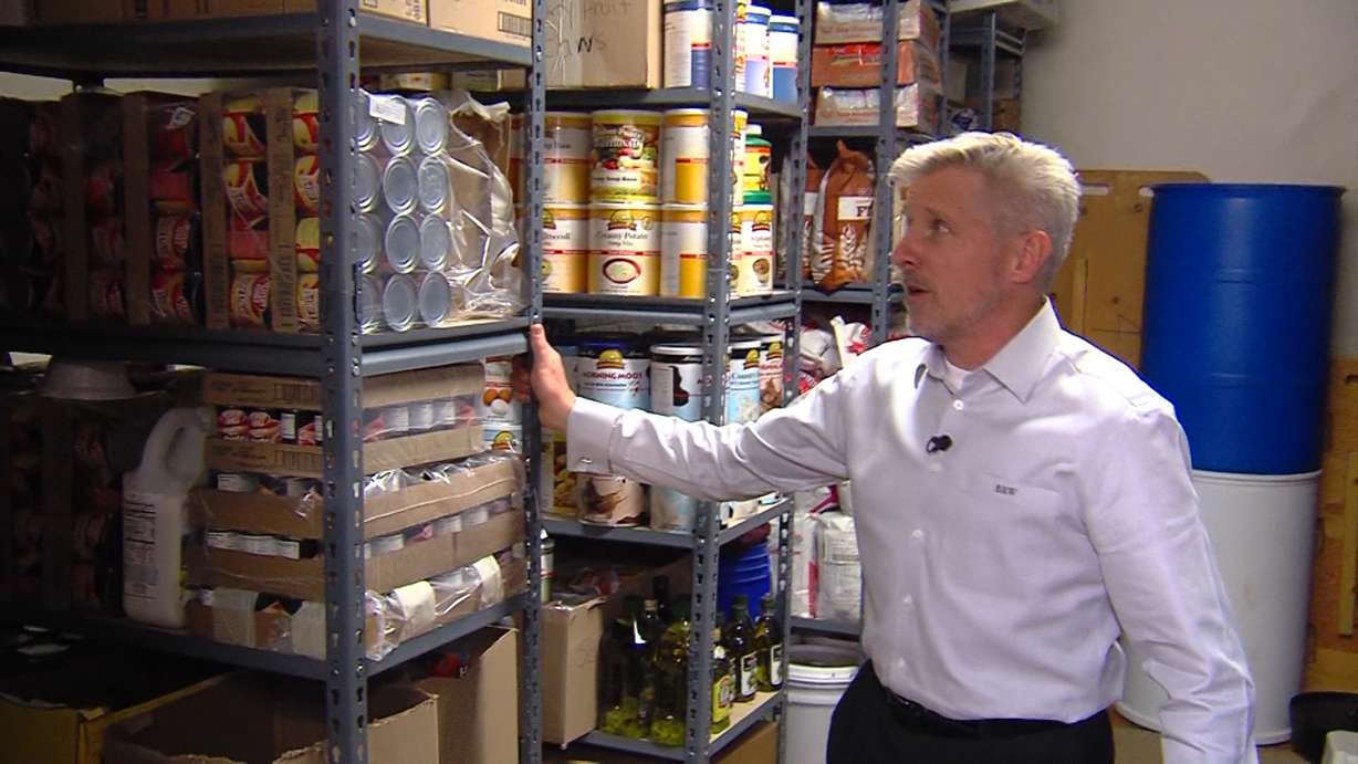 Brett Williams shows off "the vault," a secret storage room he built inside his Utah County home. Williams keeps the room stocked with everything he might need to survive following a natural disaster. (Photo: KSL-TV)
