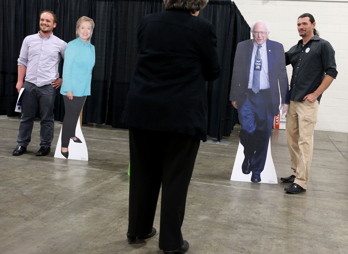 Hillary Clinton supporter Ryan Burningham, of Provo, and Bernie Sanders supporter John Farmer, of Cottonwood Heights, have their photographs taken at the Democratic Convention at the Salt Palace in Salt Lake City on Friday, April 22, 2016. (Photo: Laura Seitz, Deseret News)