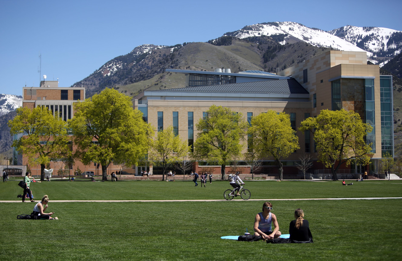 People hang out on the quad in front of the Agricultural Sciences building at Utah State University in Logan on Wednesday, April 20, 2016. (Photo: Kristin Murphy, Deseret News)