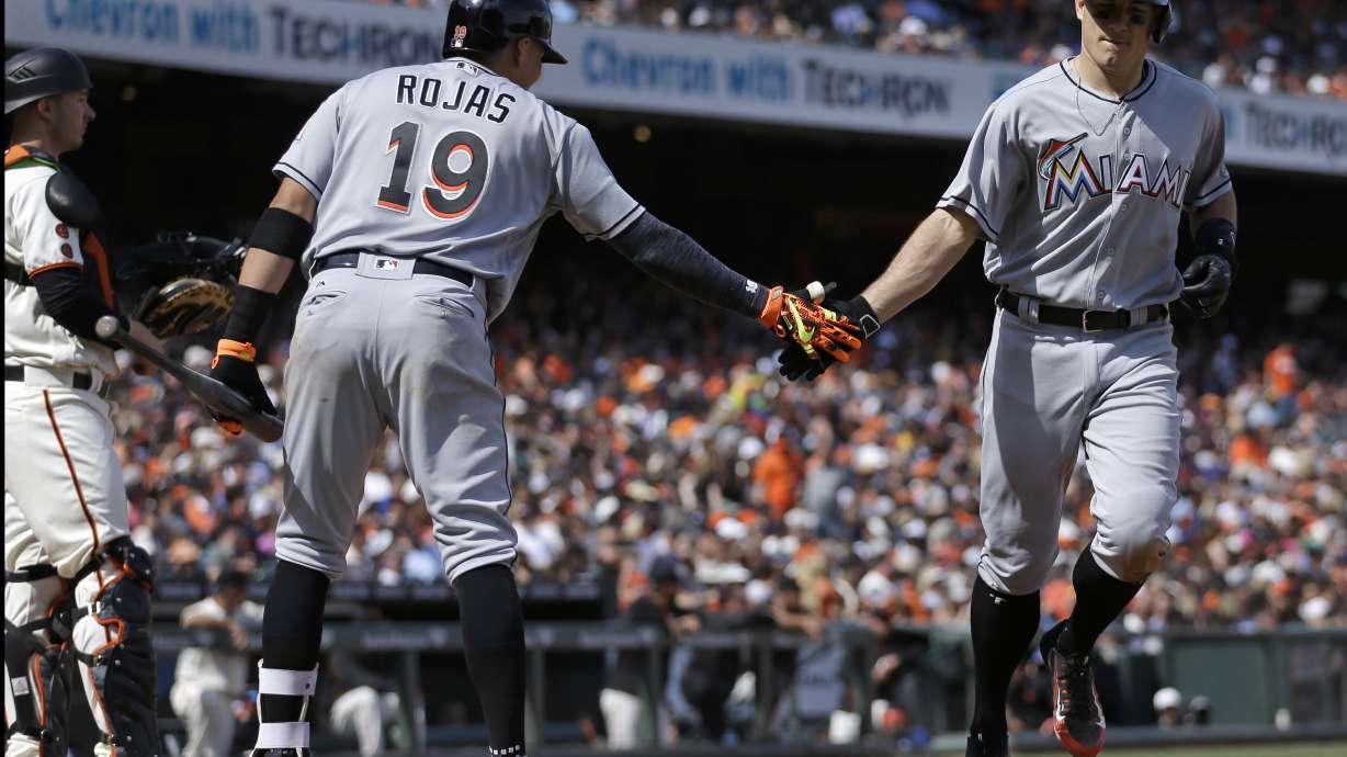 Marlins hold off Giants 5-4 to avoid 3-game sweep
