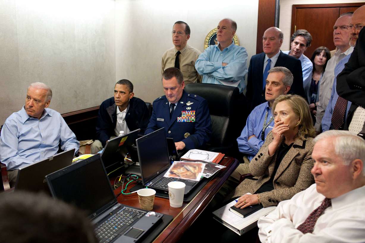In this May 1, 2011 file image released by the White House and digitally altered by the source to diffuse the paper in front of Secretary of State Hillary Rodham Clinton, President Barack Obama and Vice President Joe Biden, along with with members of the national security team, receive an update on the mission against Osama bin Laden in the Situation Room of the White House in Washington. (AP Photo/The White House, Pete Souza, File)