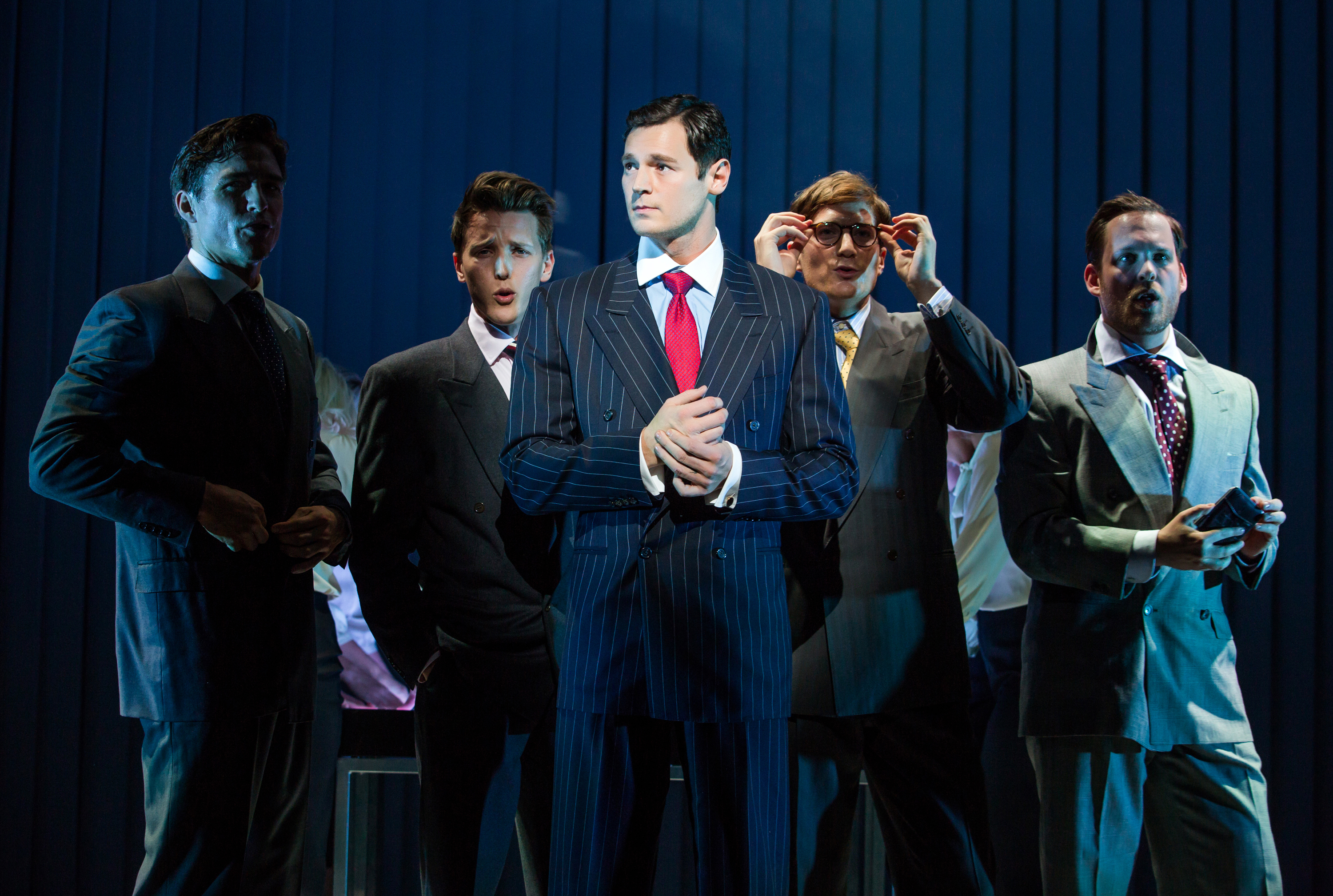 This image released by Jeffrey Richards Associates shows Benjamin Walker, center, and the cast during a performance of "American Psycho," opening at the Gerald Schoenfeld Theatre in New York. (Jeremy Daniel/Jeffrey Richards Associates via AP)