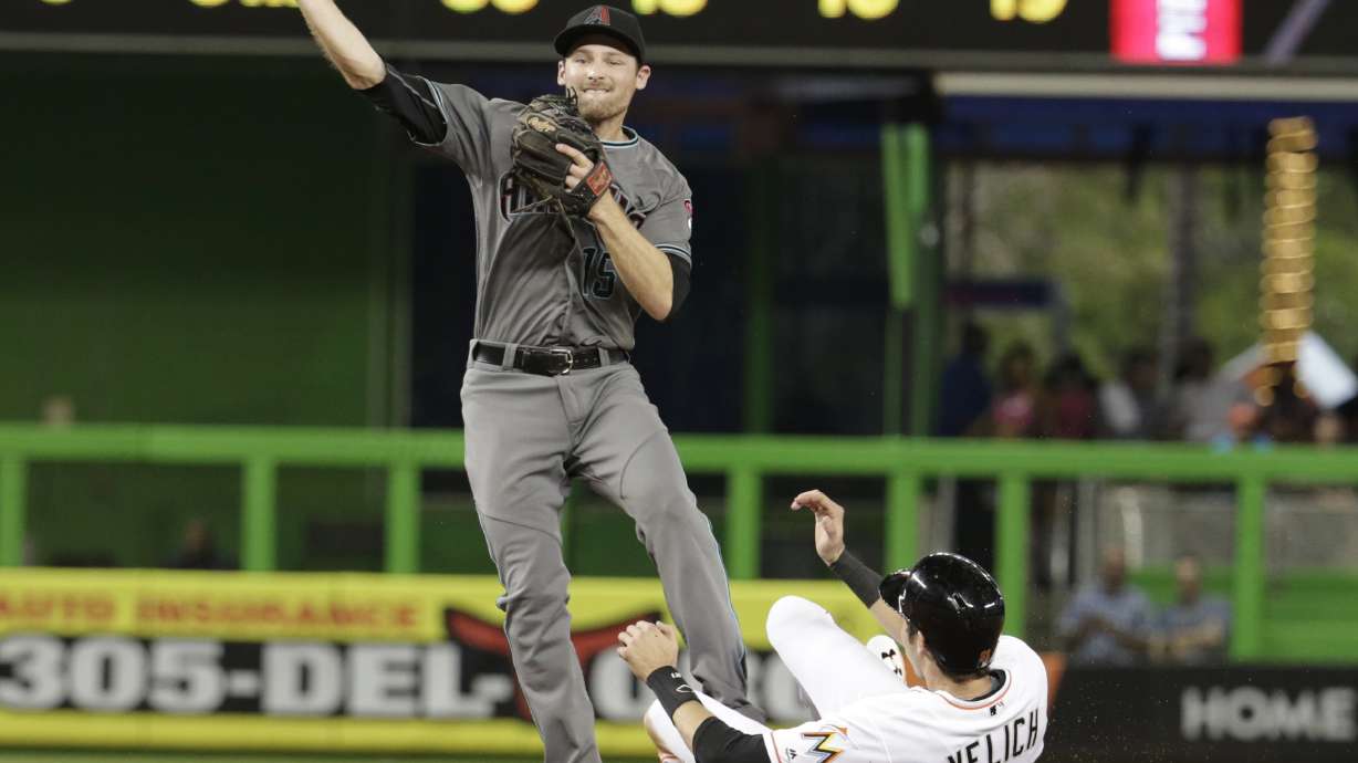 Suzuki's pinch-hit helps Marlins beat Arizona 7-4