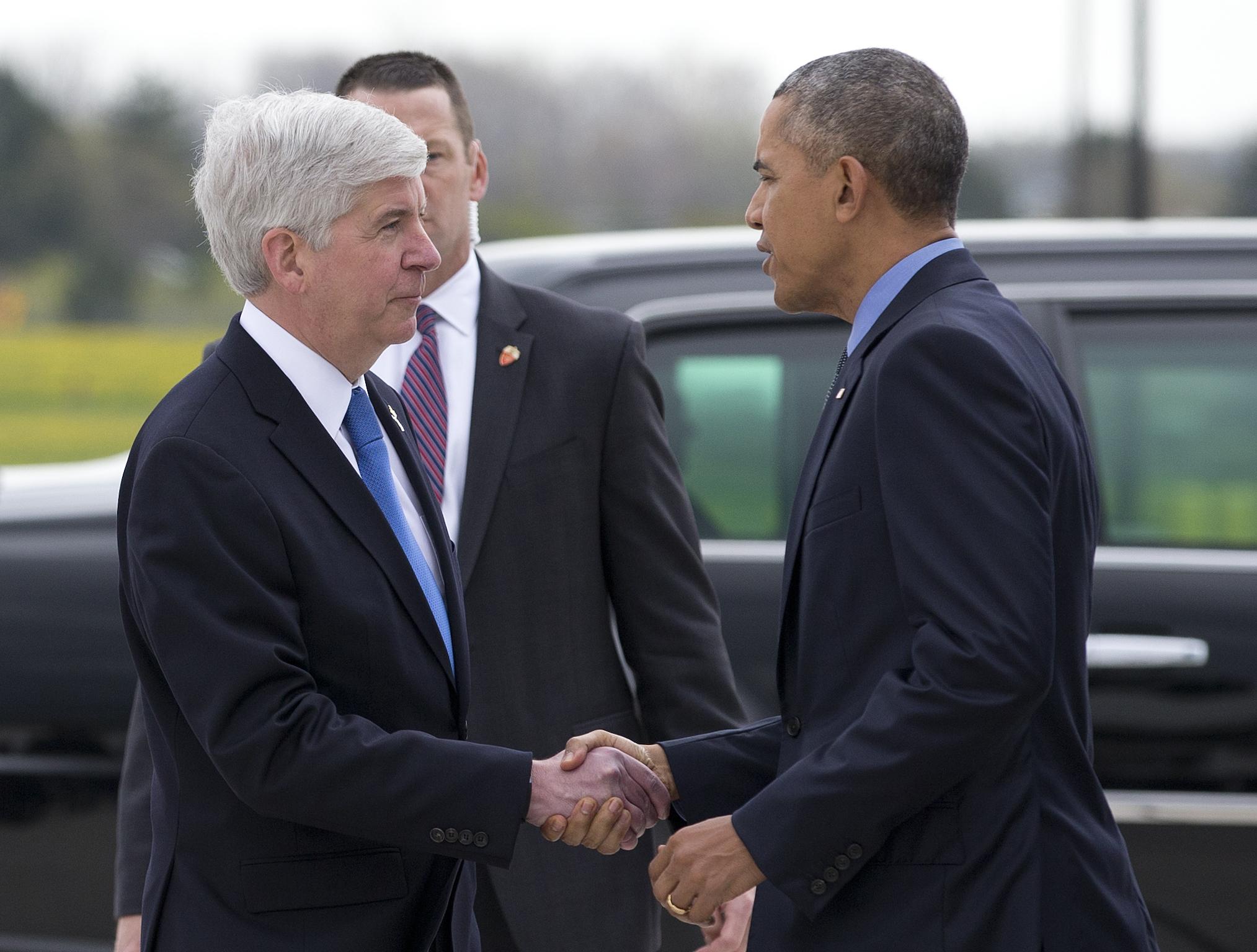 The Latest: Rough treatment of Gov. Snyder draws sympathy