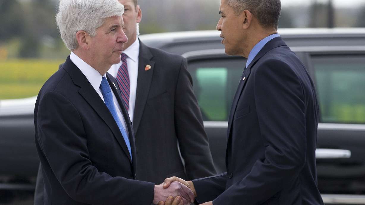 The Latest: Rough treatment of Gov. Snyder draws sympathy