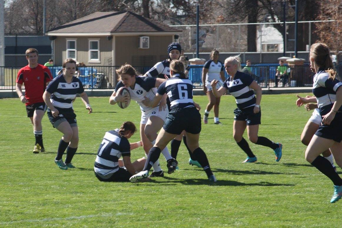 BYU flanker Heidi Galster battles opposing tacklers. (Courtesy Photo: BYU women's rugby)