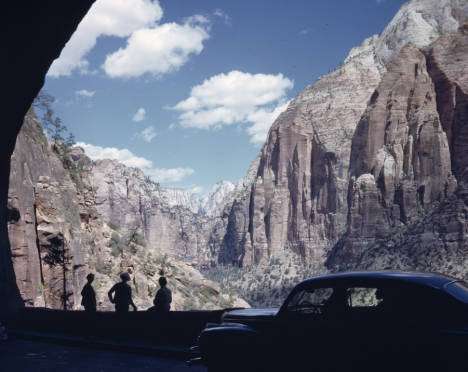 Individuals get out of a car to look at the view at the Mount Carmel tunnel in Zion National Park, dated in 1950s. (Photo: Al Watkins Morton, Photo Courtesy Utah State History)