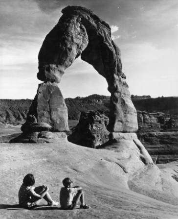 Sightseers look at Delicate Arch at Arches National Park, dated sometime between 1930-1945. (Photo: Photo Courtesy Utah State Historical Society)