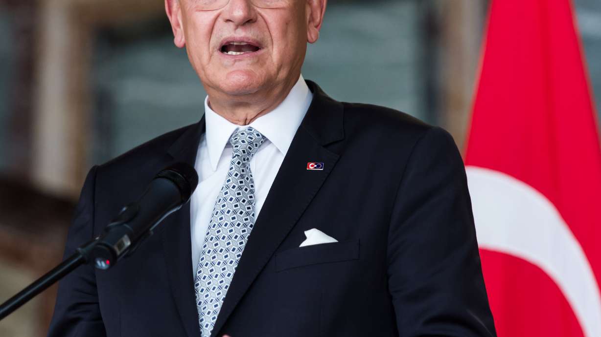 The Latest: Report says EU anti-smuggler force ineffective