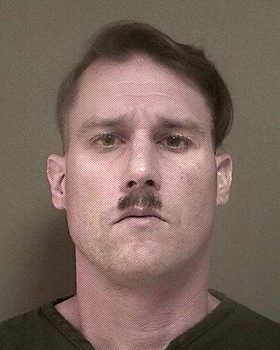 Man with Hitler mustache charged in weapons, ammo case