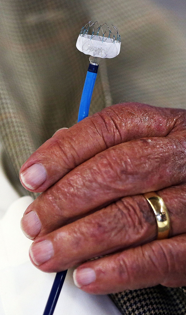 Wilford Brimley holds a WATCHMAN left atrial appendage closure device at Intermountain Medical Center in Murray on Monday, May 16, 2016. He is a recipient of the device. (Photo: Ravell Call, Deseret News)