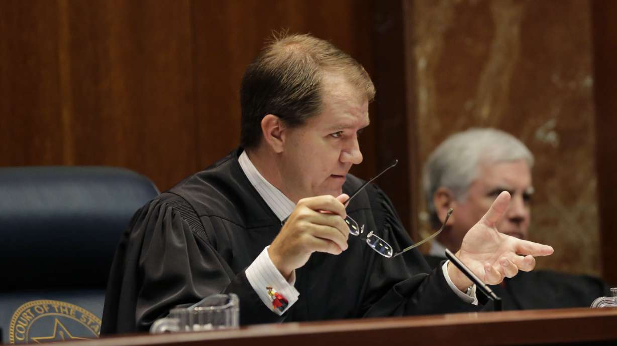 The Latest: Clinton campaign slams Trump Supreme Court list