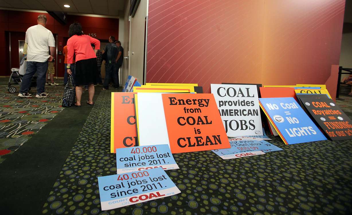 Signs supporting coal production are left outside a scoping meeting to discuss possible U.S. Department of the Interior coal mining reforms at the Salt Palace Convention Center in Salt Lake City on Thursday, May 19, 2016. (Photo: Chris Samuels, Deseret News)