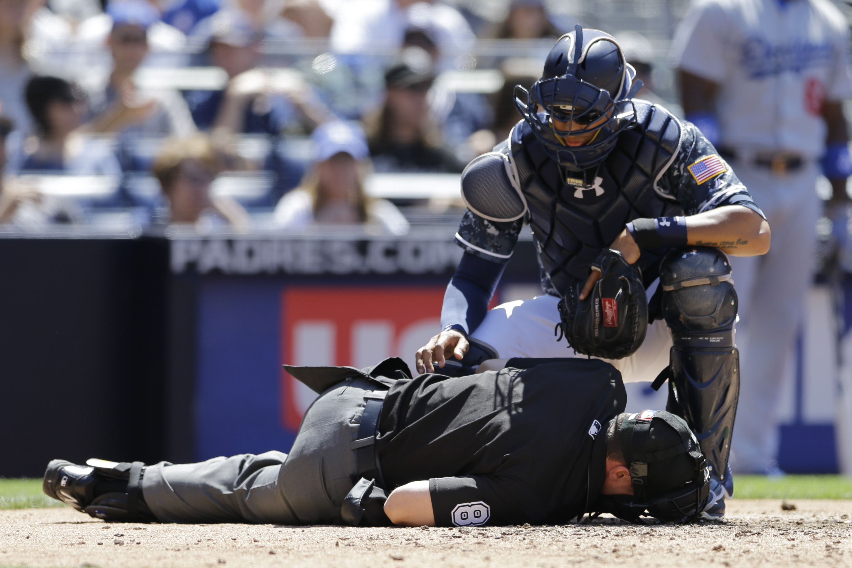 Plate umpire Rackley leaves after getting hit by foul bunt