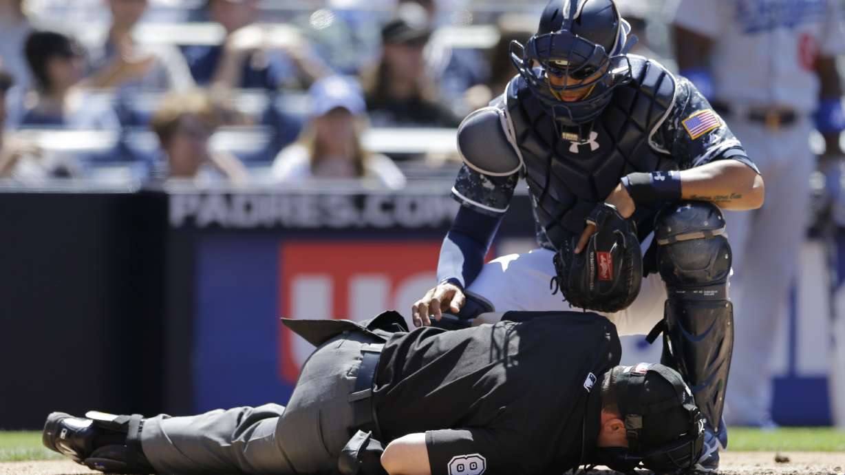 Plate umpire Rackley leaves after getting hit by foul bunt