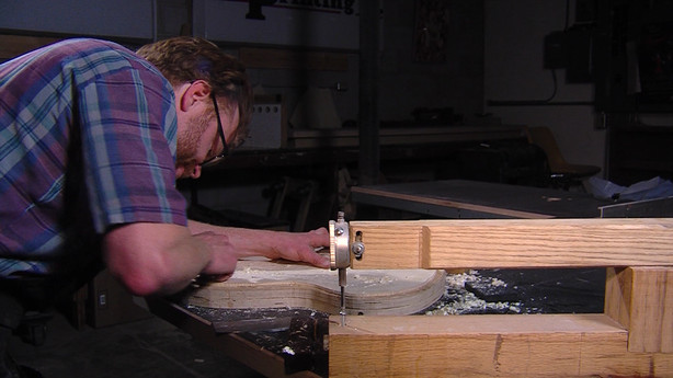 "I started building my first guitar when I was fourteen," Ryan Thorell said as a strip of wood hissed and popped from being pressed against a hot bending iron. "I really felt artistically fulfilled by it, and challenged."