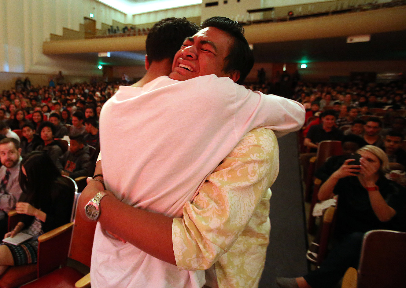 A classmate embraces Siaosi Heimuli, right, after learning he was named Granite School District's Absolutely Incredible Kid during a ceremony at Granite Park Junior High in Salt Lake City on Monday, May 23, 2016. (Photo: Chris Samuels, Deseret News)