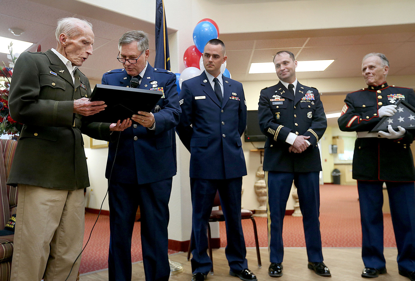 World War II veteran and Army 1st Lt. Dan M. Eastman, 96, receives a Certificate of Appreciation from retired Air Force Lt. Col. Robert King during an Honor Salute at the Olympus Ranch Retirement Community in Murray on Wednesday, May 25, 2016. (Photo: Laura Seitz, Deseret News)