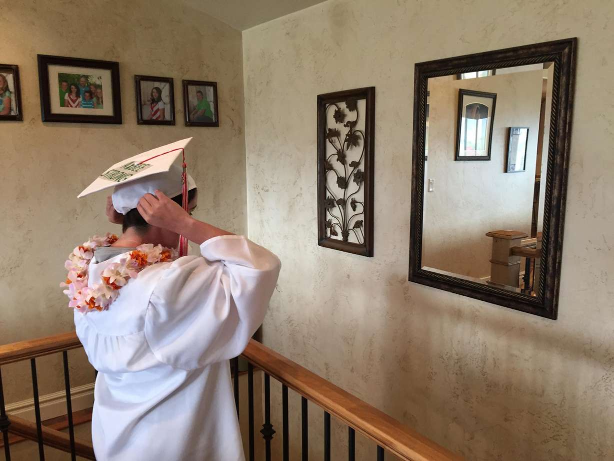 Kelsie Albee, now cancer free, gets ready for her high school graduation from Manti High School, Friday, May 27, 2016. (Photo: Sam Penrod, Deseret News)