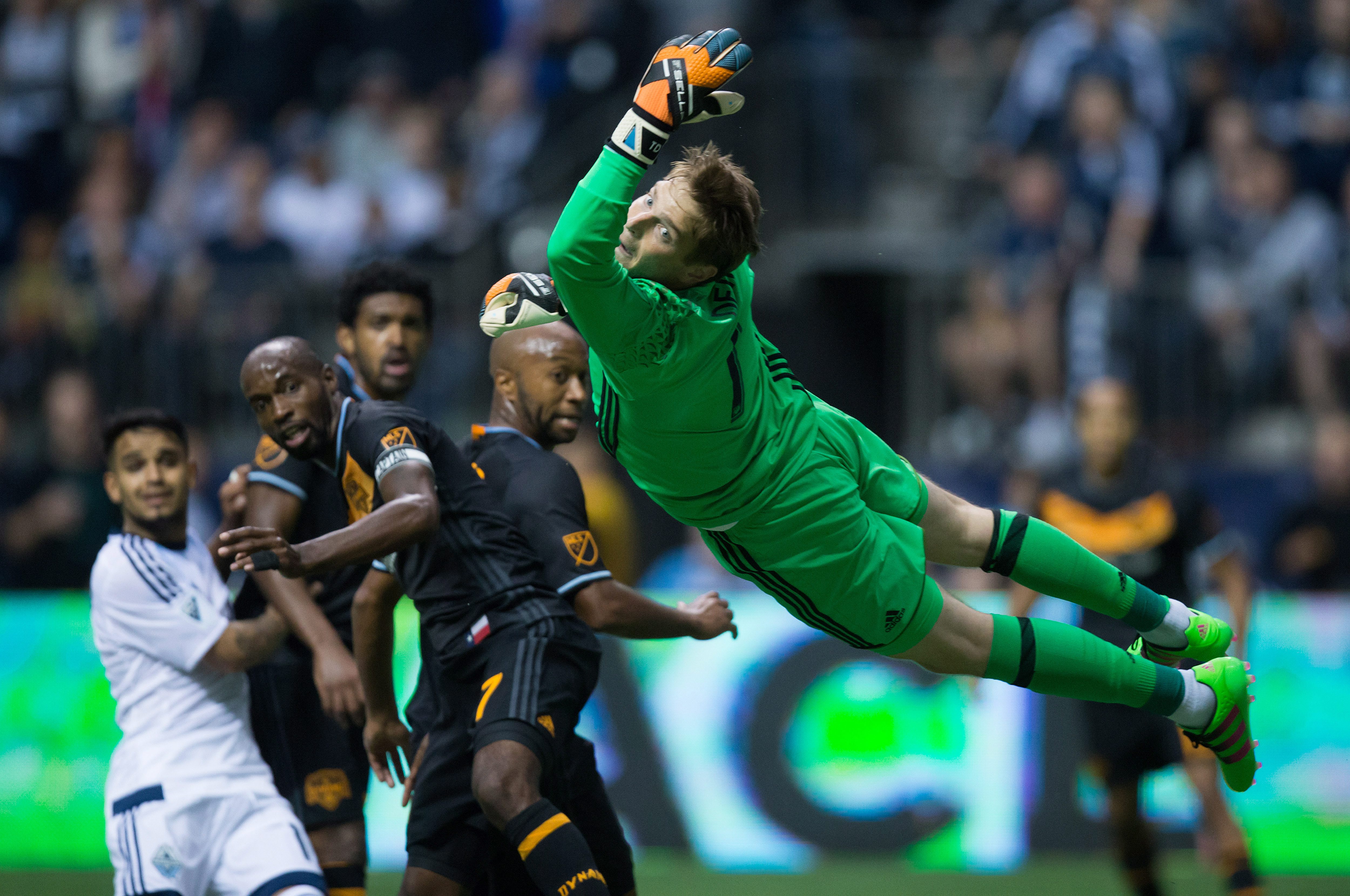 Dynamo tie Whitecaps 1-1 in first game since coach resigned
