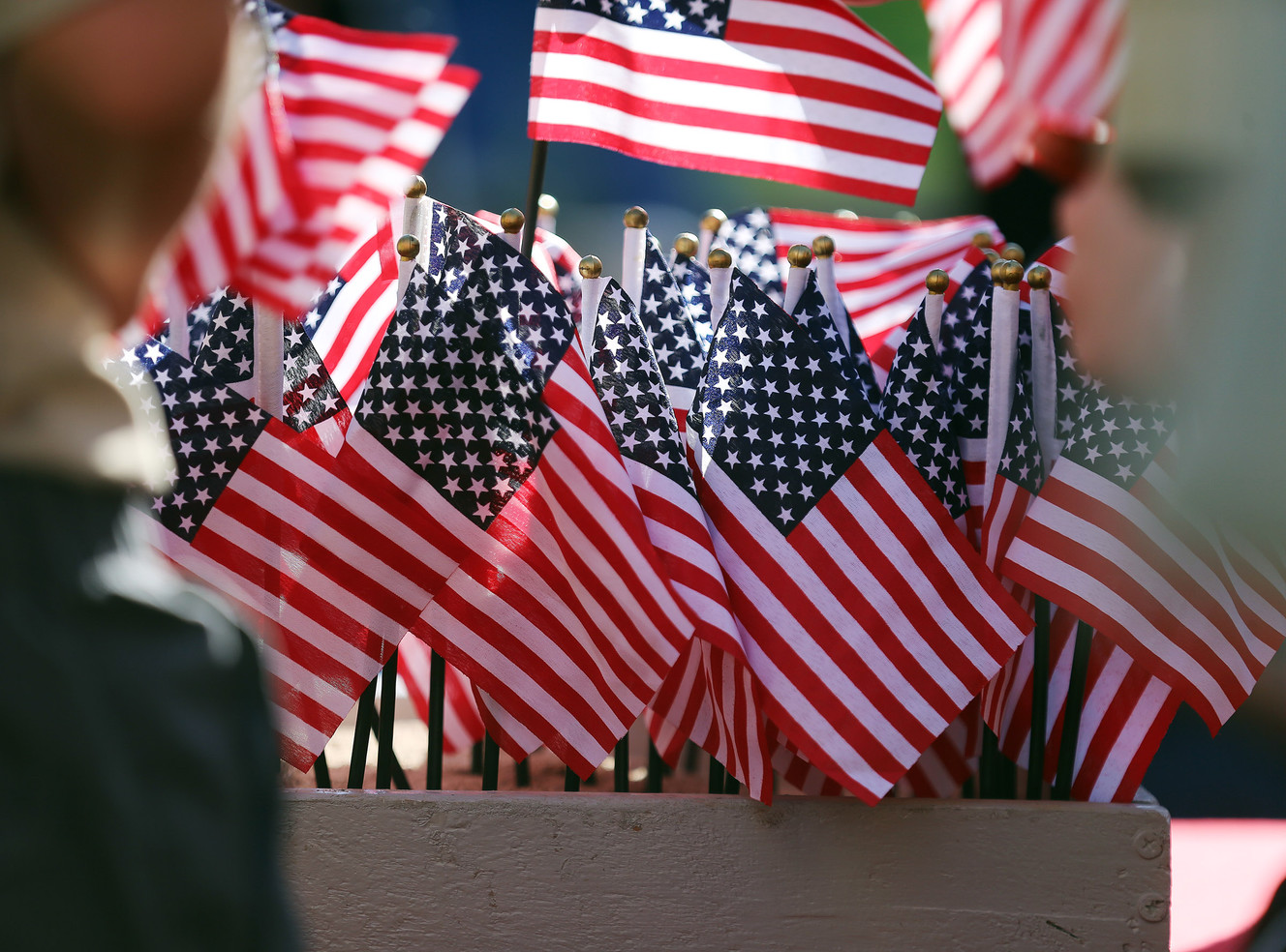 Small American flags are placed in sand for those who lost their lives during World War II as Japanese-American veterans are remembered at a memorial service at the Salt Lake City Cemetery on Sunday, May 29, 2016. (Photo: Scott G Winterton, Deseret News)