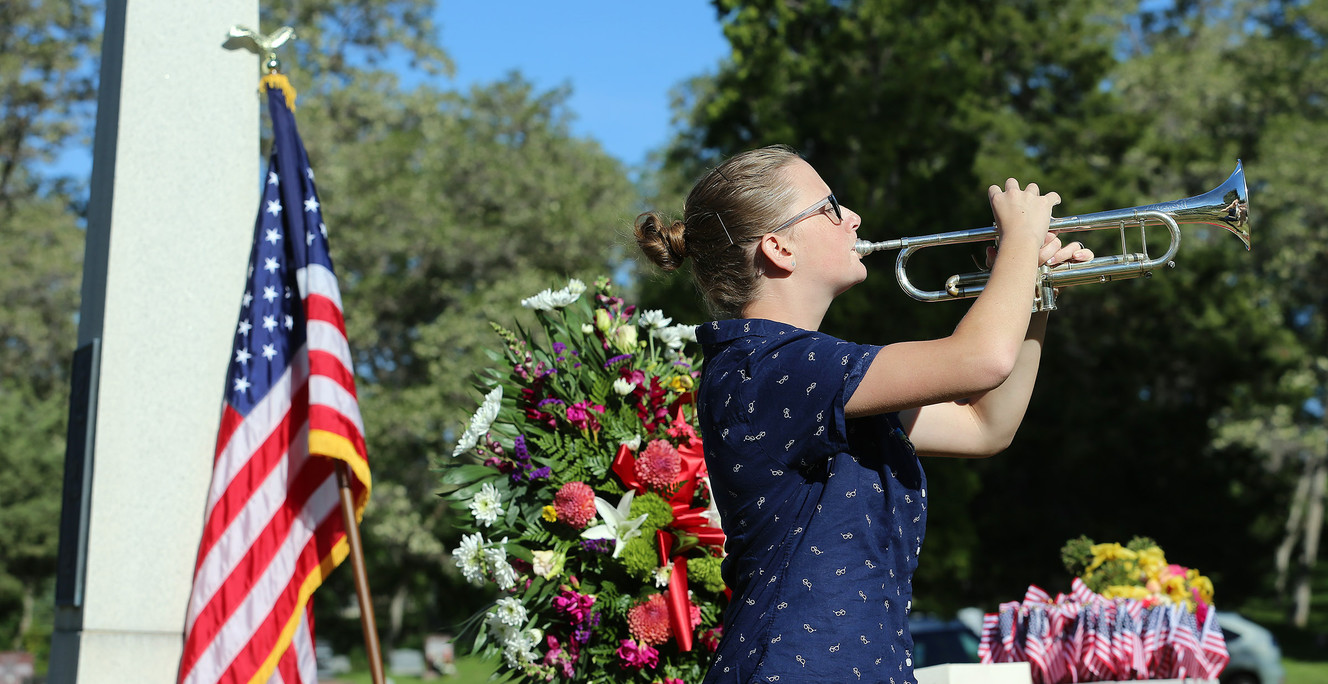 Sam Huston plays taps at a memorial service honoring Japanese-American veterans at the Salt Lake City Cemetery on Sunday, May 29, 2016. (Photo: Scott G Winterton, Deseret News)