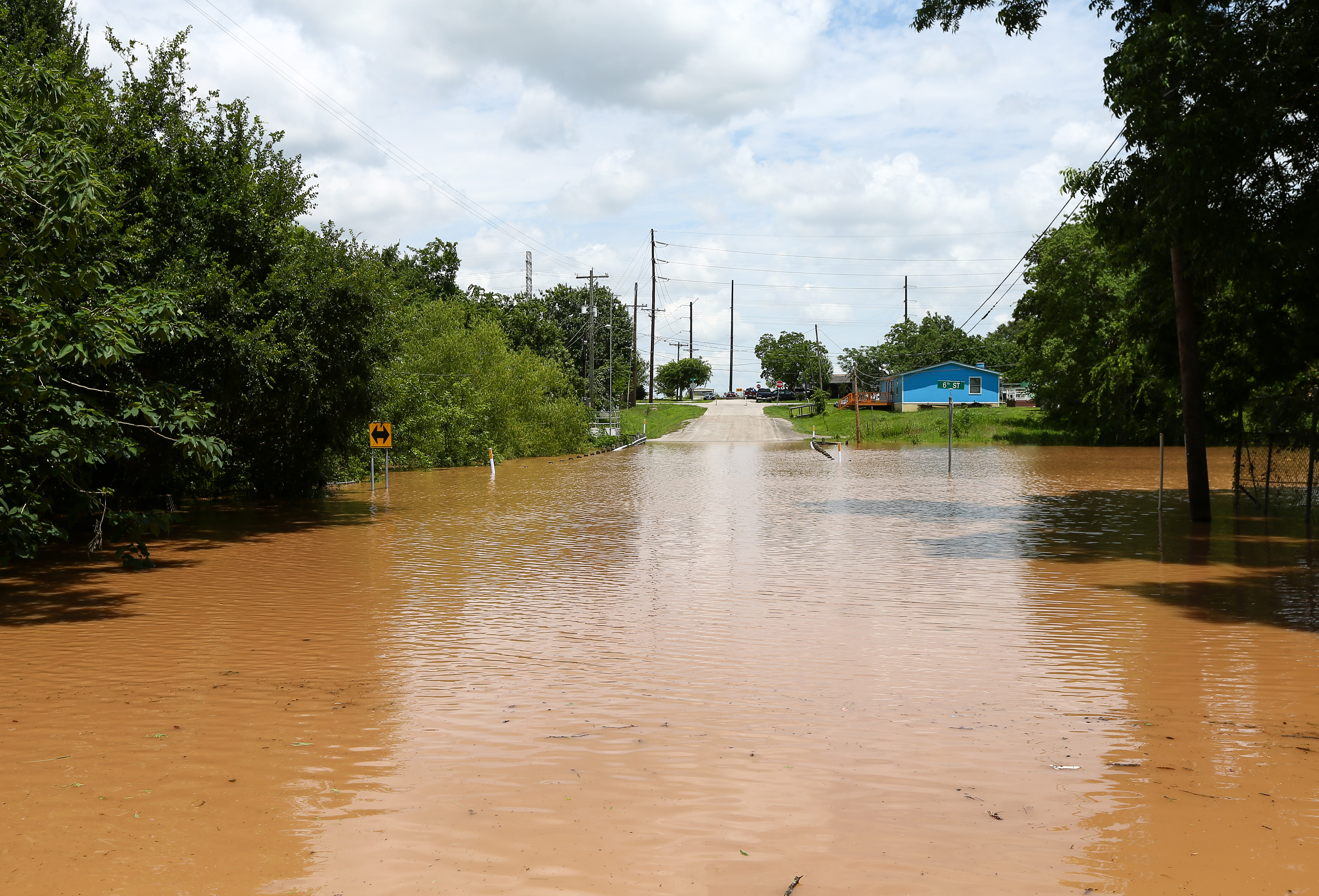 Swollen river feeds flooding near Houston as residents flee