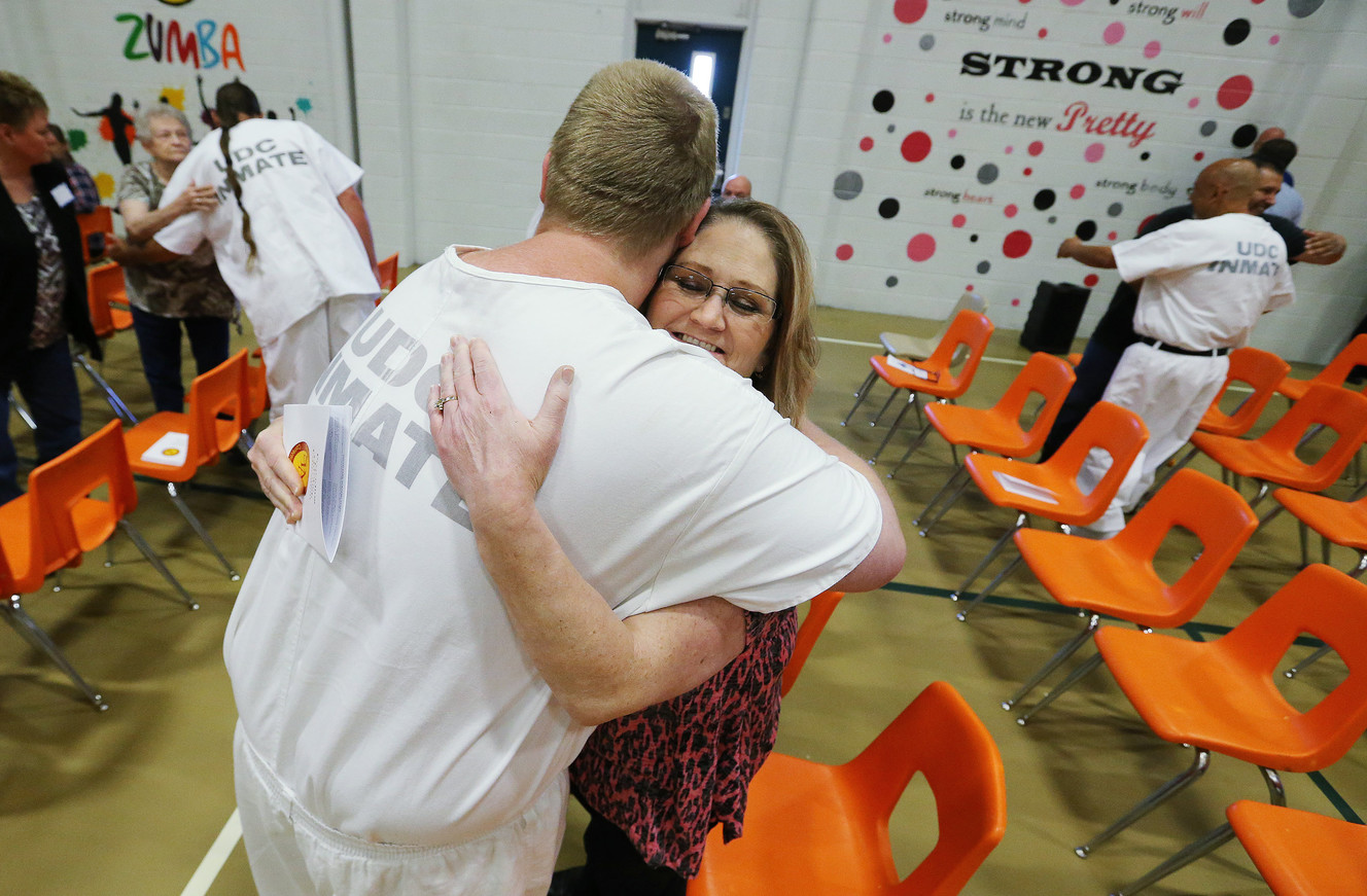 South Park Academy graduate Kamron Sorensen hugs his mother, Lisa, after high school commencement ceremonies at the Utah State Prison in Draper on Wednesday, June 1, 2016. (Photo: Jeffrey D. Allred, Deseret News)