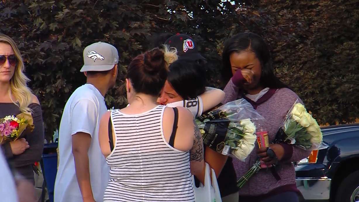At a vigil for Natalia Casagrande in front of her home Thursday night, more than 100 mourners lit candles and played music as friends and family consoled her husband. Police say 24-year-old Casagrande was killed in her home Tuesday, May 31, 2016. (Photo: Adam Sotelo, KSL-TV)