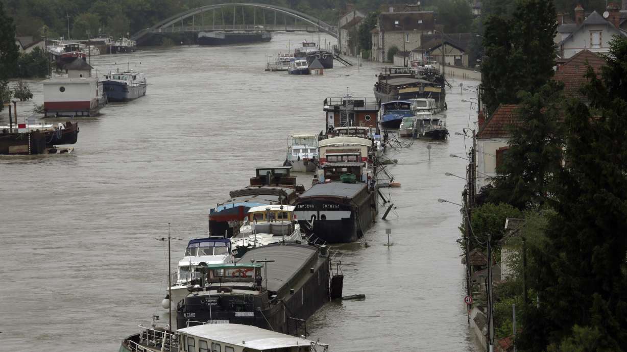 The Latest: French president: Paris floods are 'exceptional'