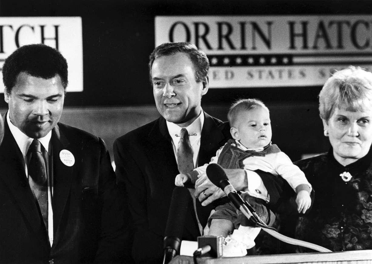 Sen. Orrin Hatch, R-Utah, center, holds his grandchild during an election event on Nov. 9, 1988, attended by Muhammad Ali, left, and Hatch's wife, Elaine. Ali died Friday, June 3, 2016, at age 74. (Photo: Deseret News Archives)