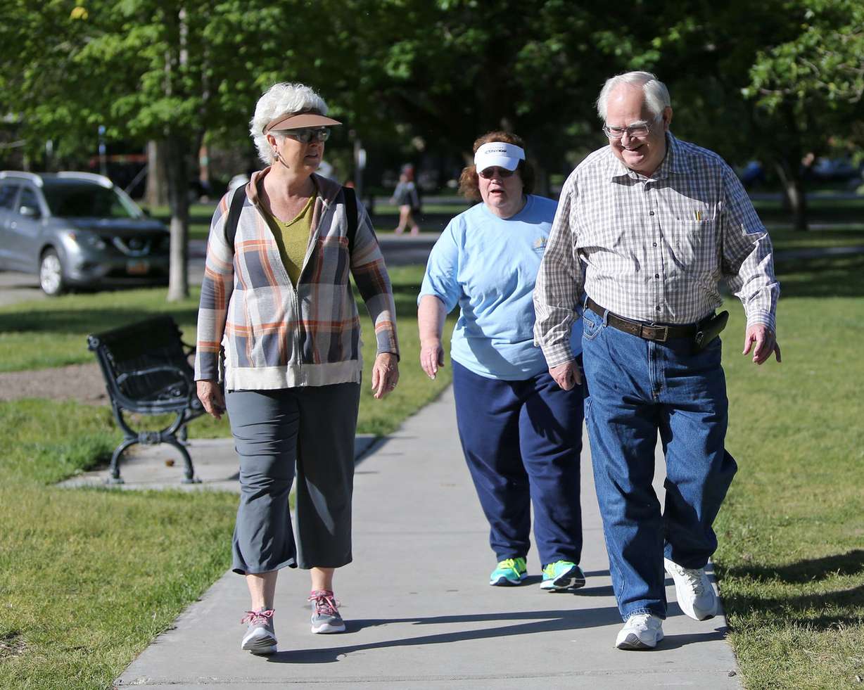 Julie Jacobson, left, Pat Wilson and Les Wilson walk around Liberty Park in Salt Lake City on Wednesday, June 1, 2016. (Photo: Kristin Murphy, Deseret News)