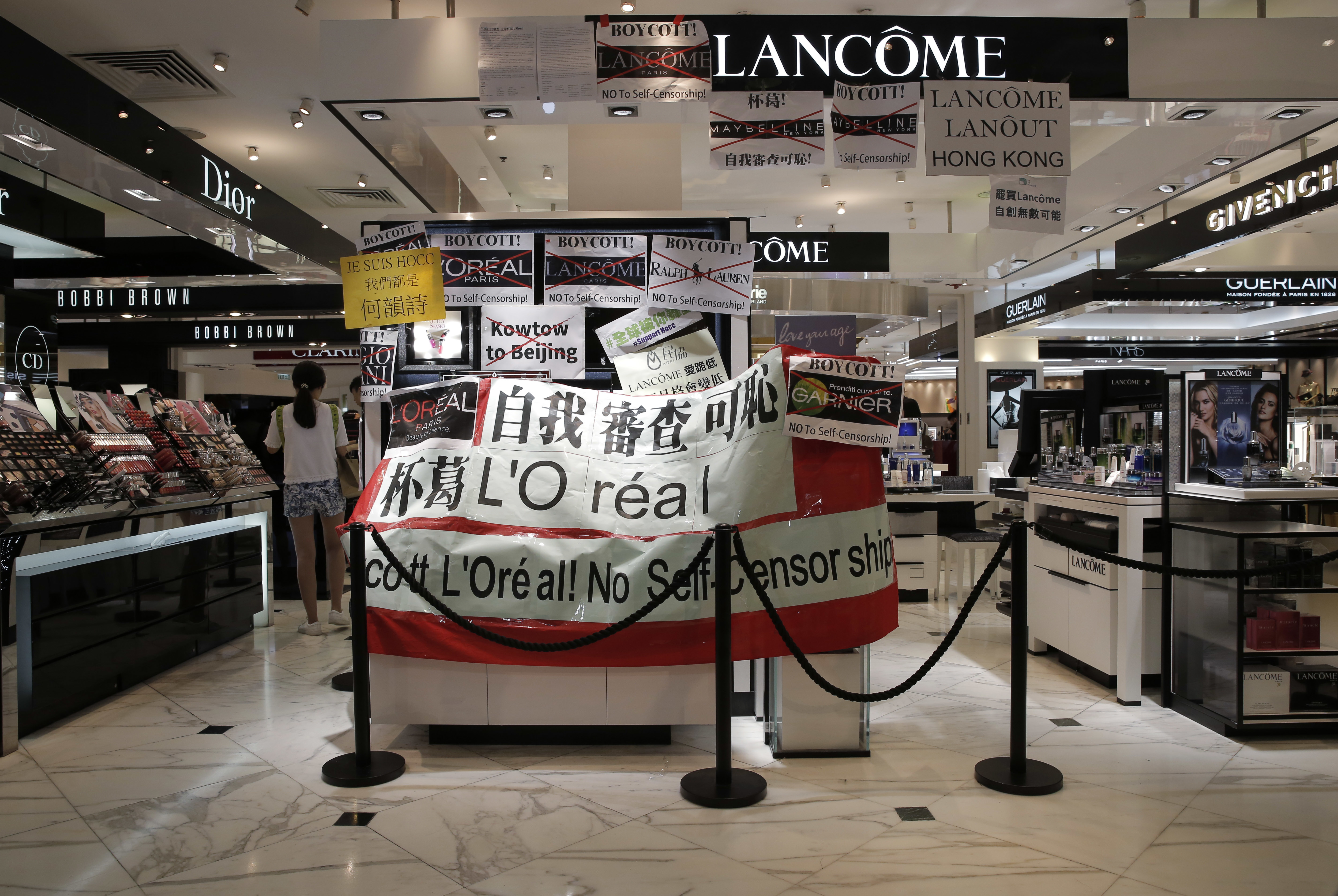 Lancome shuts Hong Kong shops as 'kowtow' controversy grows