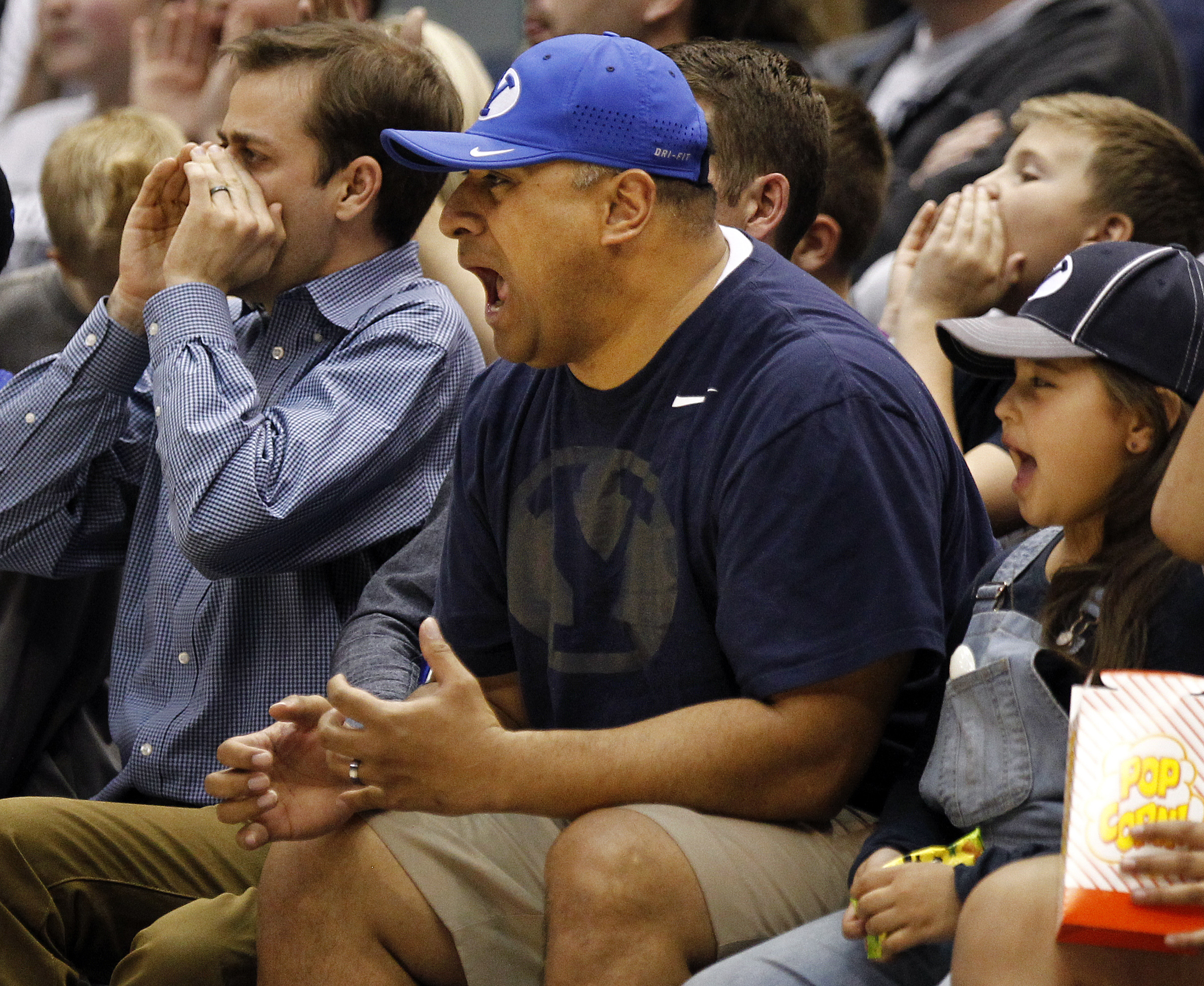 Brigham Young Cougars football head coach Kalani Sitake cheers the basketball team on during the first round of the NIT versus the UAB Blazers at the Marriott Center in Provo, Wednesday, March 16, 2016. (Photo: Luke Franke/Deseret News)