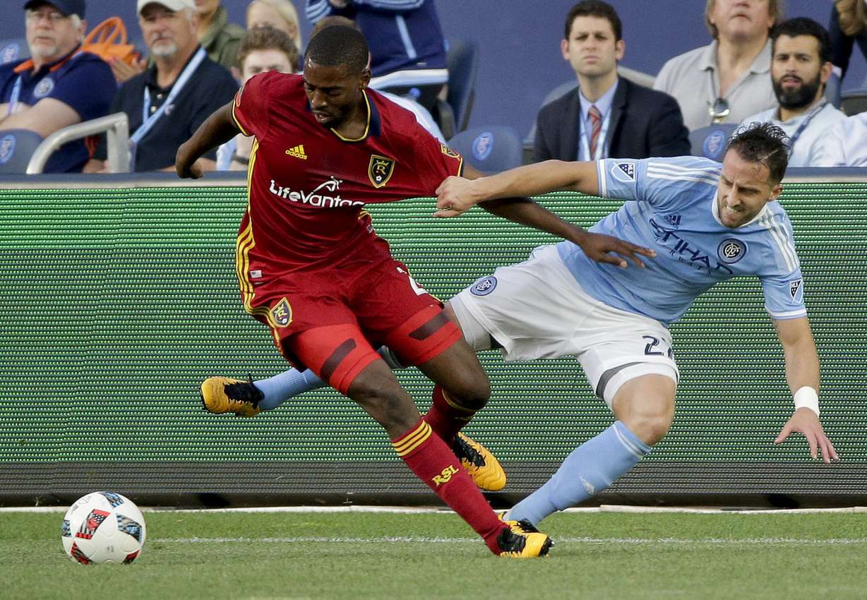 Real Salt Lake defender Aaron Maund, left, vies for the ball against New York City FC defender RJ Allen during the first half of an MLS soccer game, Thursday, June 2, 2016, in New York. Real Salt Lake won 3-2. (AP Photo/Julie Jacobson)