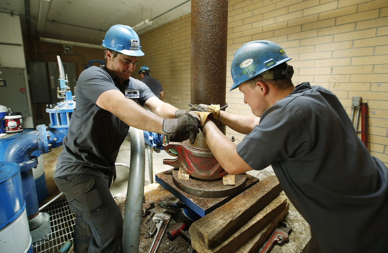 Tyler Beckwith and Riley Cluff work on a well in Elk Ridge on Wednesday, June 8, 2016. The city is prohibiting residents from watering outdoors due to an equipment failure involving the city's main source of water. (Photo: Jeffrey D. Allred, Deseret News)