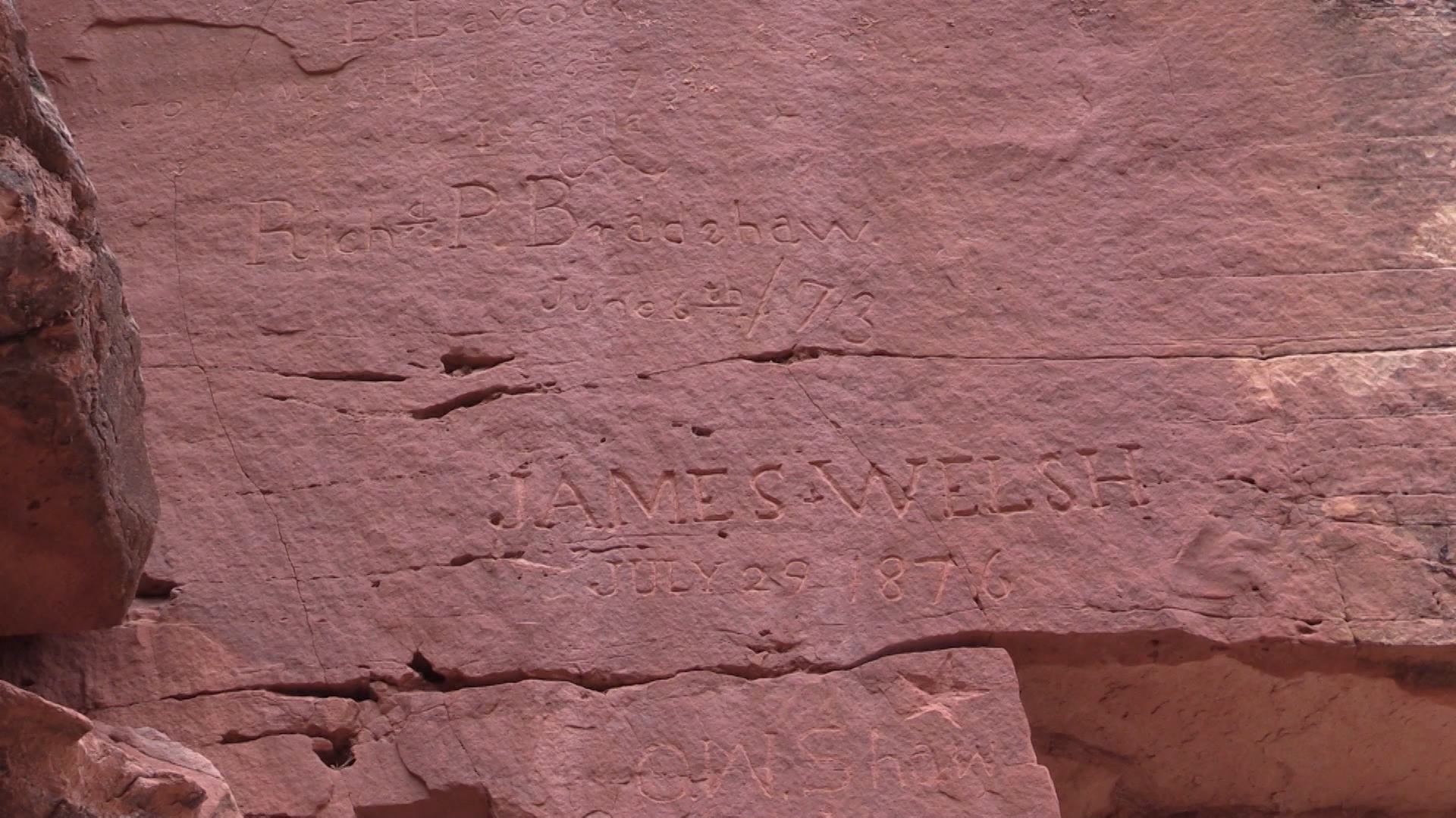 Numerous inscriptions at a place called Signature Rocks near the Utah-Arizona border record the names of pioneers and other travelers along a route that came to be known as The Honeymoon Trail. (Photo: KSL-TV)