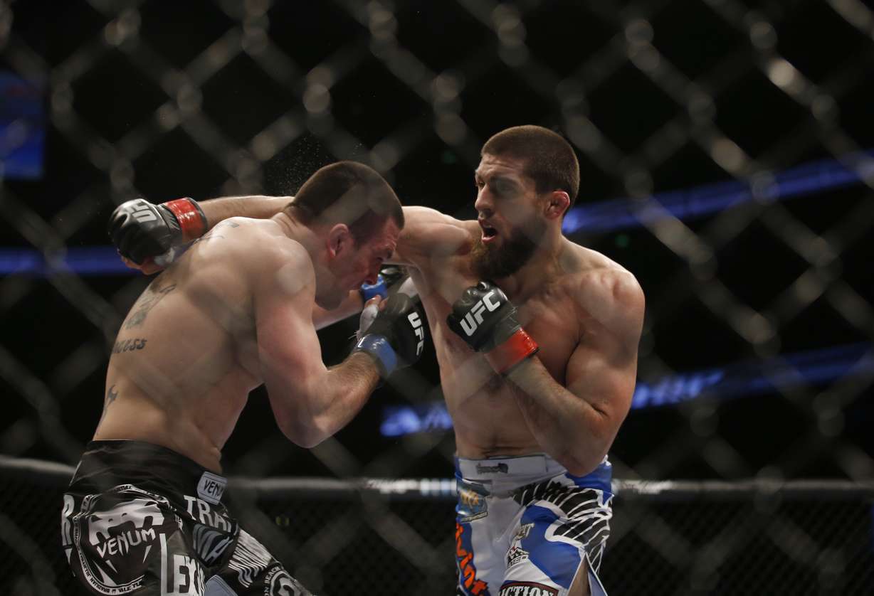 Court McGee, right, and Josh Neer trade punched during their UFC welterweight mixed martial arts match in Anaheim, Calif., Saturday, Feb. 23, 2013. (AP Photo/Jae C. Hong)