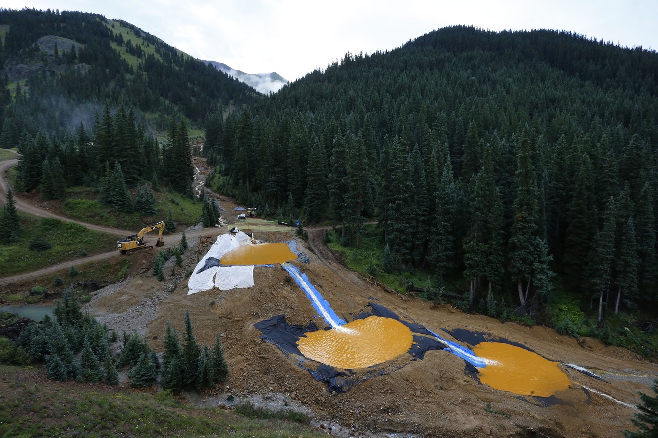 In this Aug. 12, 2015 file photo, water flows through a series of retention ponds built to contain and filter out heavy metals and chemicals from the Gold King mine chemical accident, in the spillway about 1/4 mile downstream from the mine, outside Silverton, Colo. A U.S. House probe of the mine waste accident in Colorado that fouled rivers in three states with arsenic, lead and other toxic substances has found further evidence that EPA workers knew a spill from the gold mine was possible, according to documents released Thursday, Feb. 11, 2016 by a U.S. House committee. (AP Photo/Brennan Linsley, file) (Photo: Brennan Linsley, Associated Press)