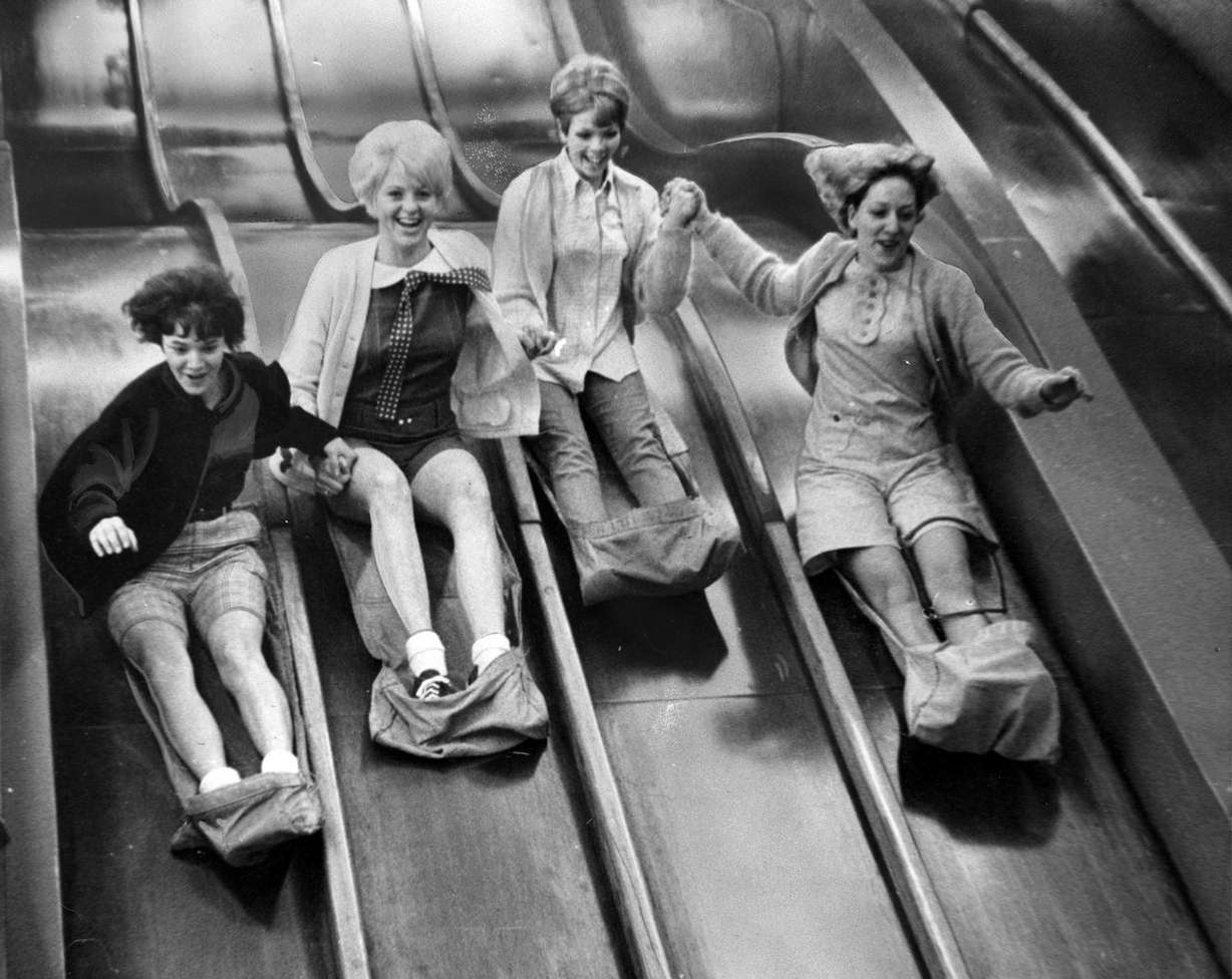 Here come Spanish Fork students Molly Stansfield, Sherry Pyper, Karma Ivory, Camille Fox down the Giant slide at Lagoon, May 12, 1967. (J. M. Heslop, Deseret News Archives)