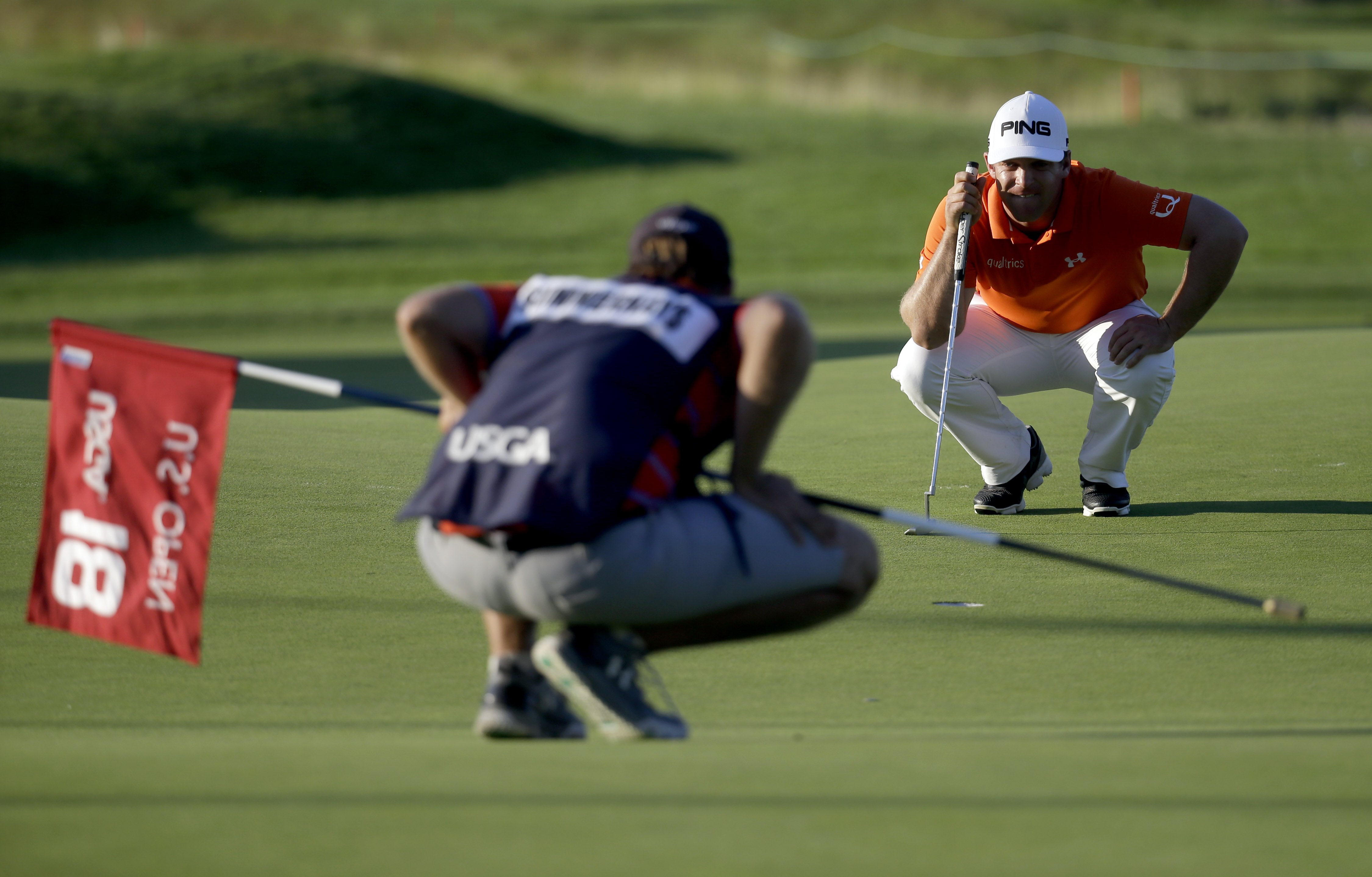 Daniel Summerhays lines up his putt on the 18th hole during the rain delayed second round of the U.S. Open golf championship at Oakmont Country Club on Friday, June 17, 2016, in Oakmont, Pa. (AP Photo/John Minchillo)